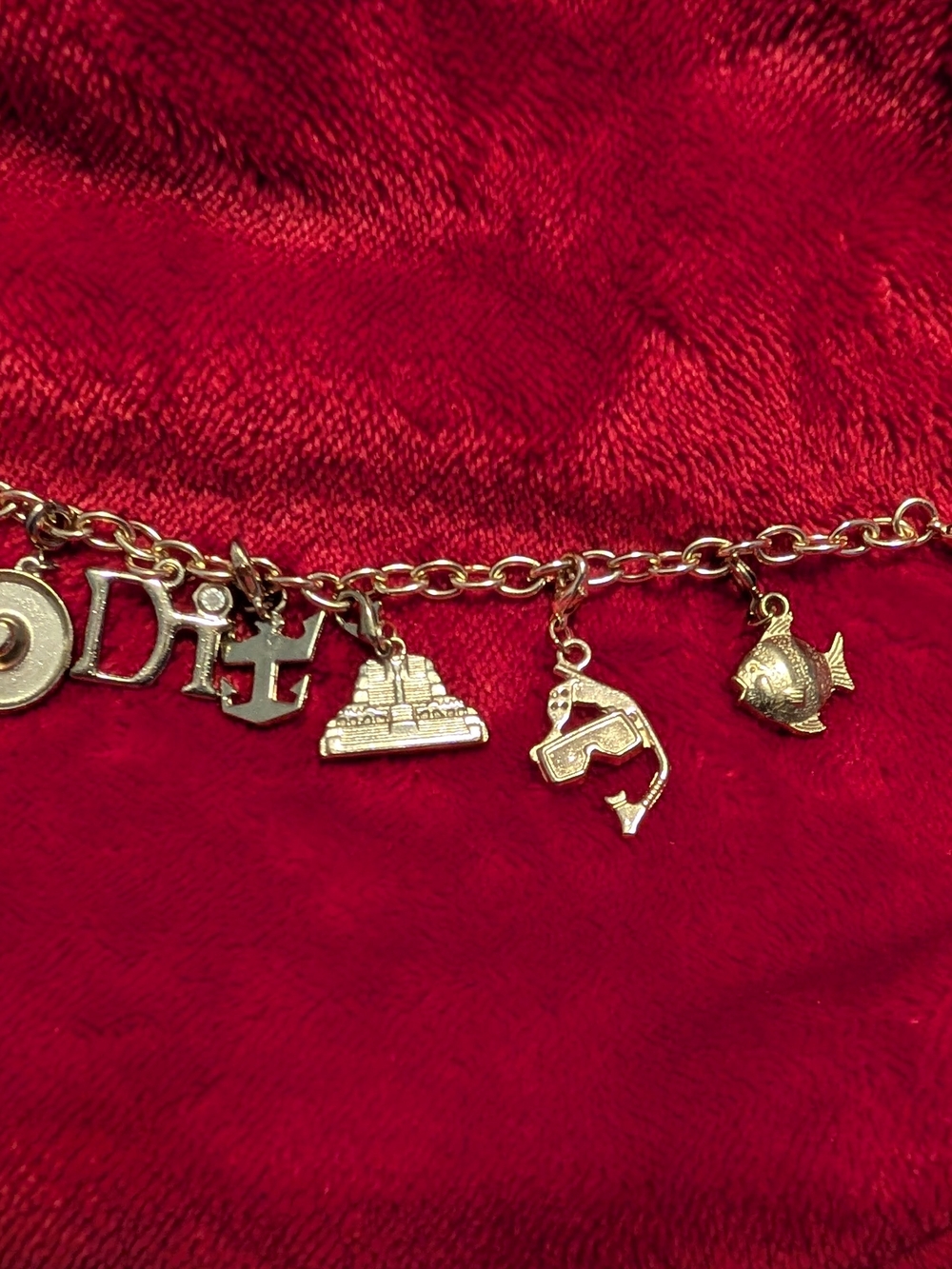 This is a Diamond International charm bracelet featuring a port of call charm